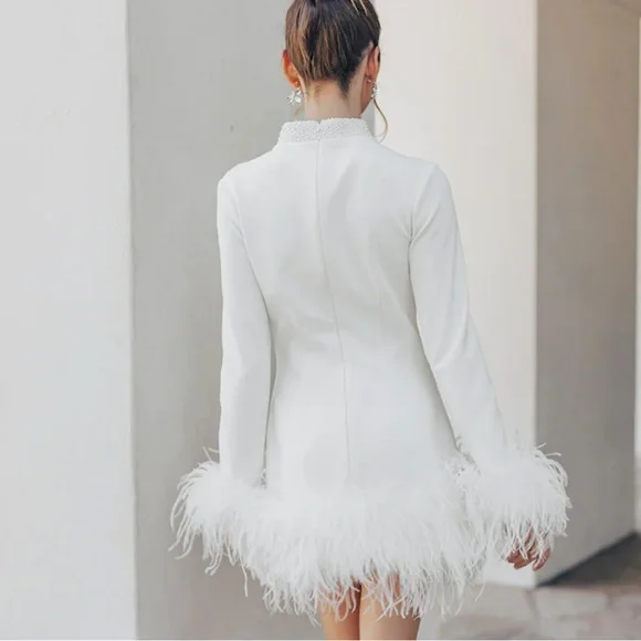 White mini dress with fur trimming from Untamed Petals. - Picture 5 of 6